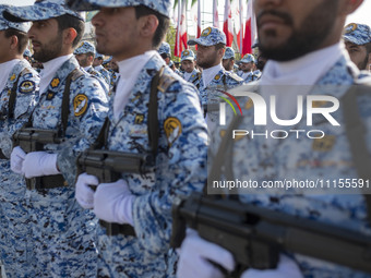 Members of the Iranian Army's air force are marching in a military parade to mark the anniversary of Iran's Army Day at an Army military bas...