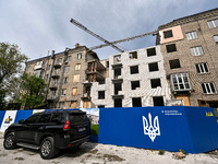 A residential building at 80 Nezalezhnoi Ukrainy Street/3 Yakova Novytskoho Street is undergoing reconstruction after being destroyed by Rus...