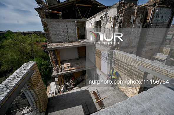 A residential building at 80 Nezalezhnoi Ukrainy Street/3 Yakova Novytskoho Street is undergoing reconstruction after being destroyed by Rus...