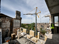 A residential building at 80 Nezalezhnoi Ukrainy Street/3 Yakova Novytskoho Street is undergoing reconstruction after being destroyed by Rus...