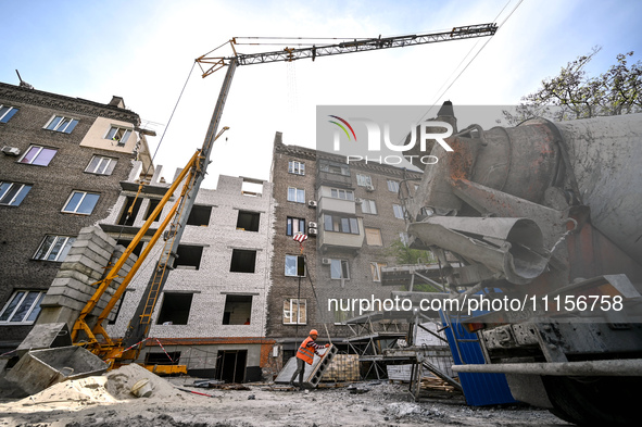 A residential building at 80 Nezalezhnoi Ukrainy Street/3 Yakova Novytskoho Street is undergoing reconstruction after being destroyed by Rus...