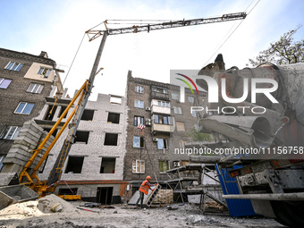 A residential building at 80 Nezalezhnoi Ukrainy Street/3 Yakova Novytskoho Street is undergoing reconstruction after being destroyed by Rus...