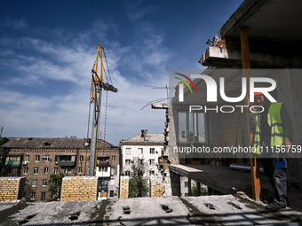 A residential building at 80 Nezalezhnoi Ukrainy Street/3 Yakova Novytskoho Street is undergoing reconstruction after being destroyed by Rus...