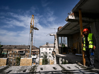 A residential building at 80 Nezalezhnoi Ukrainy Street/3 Yakova Novytskoho Street is undergoing reconstruction after being destroyed by Rus...