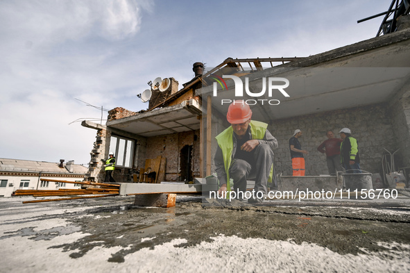 A residential building at 80 Nezalezhnoi Ukrainy Street/3 Yakova Novytskoho Street is undergoing reconstruction after being destroyed by Rus...