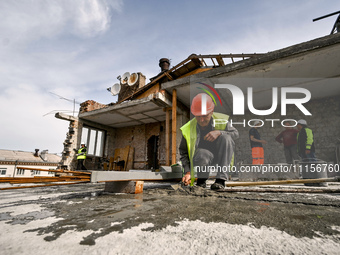 A residential building at 80 Nezalezhnoi Ukrainy Street/3 Yakova Novytskoho Street is undergoing reconstruction after being destroyed by Rus...