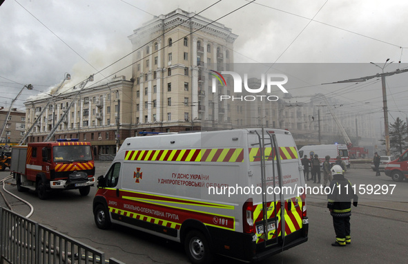 Rescue vehicles are outside the residential building damaged by the Russian missile attack in Dnipro, Ukraine, on April 19, 2024. 