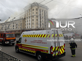 Rescue vehicles are outside the residential building damaged by the Russian missile attack in Dnipro, Ukraine, on April 19, 2024. (