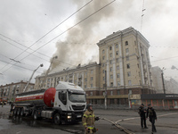 Rescue vehicles are outside the residential building damaged by the Russian missile attack in Dnipro, Ukraine, on April 19, 2024. (