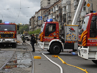 Rescue vehicles are outside the residential building damaged by the Russian missile attack in Dnipro, Ukraine, on April 19, 2024. (