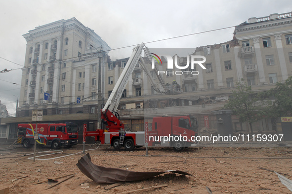 Rescue vehicles are outside the residential building damaged by a Russian missile attack in Dnipro, Ukraine, on April 19, 2024. 