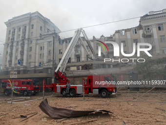 Rescue vehicles are outside the residential building damaged by a Russian missile attack in Dnipro, Ukraine, on April 19, 2024. (