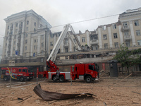 Rescue vehicles are outside the residential building damaged by a Russian missile attack in Dnipro, Ukraine, on April 19, 2024. (