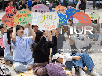 Participants in Seoul, South Korea, are holding up signs they have written themselves during the 4.19 Climate Strike and Youth Climate Actio...