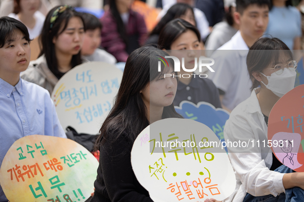 Participants in Seoul, South Korea, are holding up signs they have written themselves during the 4.19 Climate Strike and Youth Climate Actio...