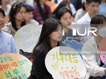 Participants in Seoul, South Korea, are holding up signs they have written themselves during the 4.19 Climate Strike and Youth Climate Actio...