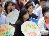 Participants in Seoul, South Korea, are holding up signs they have written themselves during the 4.19 Climate Strike and Youth Climate Actio...