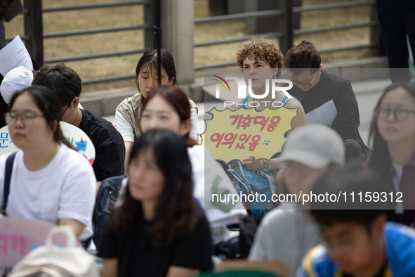 Participants in Seoul, South Korea, are holding up signs they have written themselves during the 4.19 Climate Strike and Youth Climate Actio...