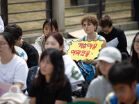 Participants in Seoul, South Korea, are holding up signs they have written themselves during the 4.19 Climate Strike and Youth Climate Actio...