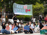 Participants in Seoul, South Korea, are holding up signs they have written themselves during the 4.19 Climate Strike and Youth Climate Actio...