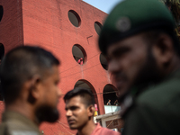 A woman is peering out from a window after a fire broke out in the intensive care unit of the Dhaka Shishu (Children) Hospital in Dhaka, Ban...