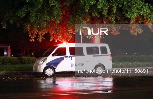 A police car is on 24-hour duty, strengthening night patrols in Chang'an town, Rong'an County, in Liuzhou, China, on April 19, 2024. 