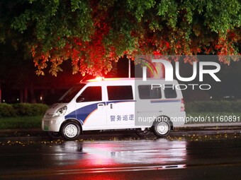 A police car is on 24-hour duty, strengthening night patrols in Chang'an town, Rong'an County, in Liuzhou, China, on April 19, 2024. (