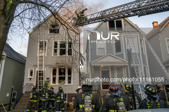 The Chicago Fire Department is battling a significant 2-11 alarm blaze at 2837 North Christiana Avenue in Chicago, Illinois, on April 19, 20...