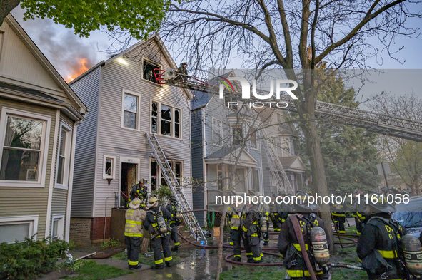 The Chicago Fire Department is battling a significant 2-11 alarm blaze at 2837 North Christiana Avenue in Chicago, Illinois, on April 19, 20...