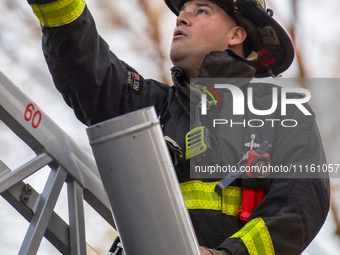  The Chicago Fire Department is battling a significant 2-11 alarm blaze at 2837 North Christiana Avenue in Chicago, Illinois, on April 19, 2...