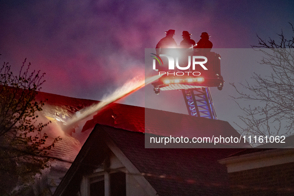 The Chicago Fire Department is battling a significant 2-11 alarm blaze at 2837 North Christiana Avenue in Chicago, Illinois, on April 19, 20...