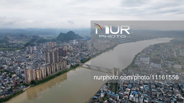 The water level of the Rongan county section of the Rongjiang River in the upper reaches of the Pearl River is rising in Liuzhou, China, on...