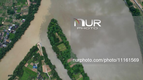 The water level of the Rongan county section of the Rongjiang River in the upper reaches of the Pearl River is rising in Liuzhou, China, on...