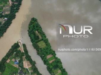 The water level of the Rongan county section of the Rongjiang River in the upper reaches of the Pearl River is rising in Liuzhou, China, on...