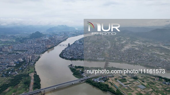 The water level of the Rongan county section of the Rongjiang River in the upper reaches of the Pearl River is rising in Liuzhou, China, on...