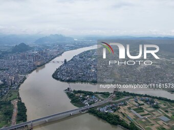 The water level of the Rongan county section of the Rongjiang River in the upper reaches of the Pearl River is rising in Liuzhou, China, on...