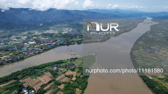 The water level of the Rongan county section of the Rongjiang River in the upper reaches of the Pearl River is rising in Liuzhou, China, on...