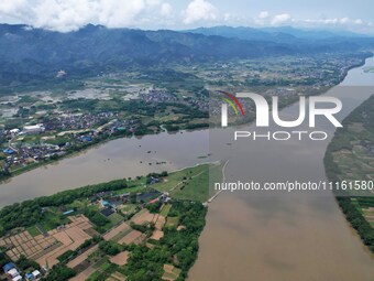 The water level of the Rongan county section of the Rongjiang River in the upper reaches of the Pearl River is rising in Liuzhou, China, on...