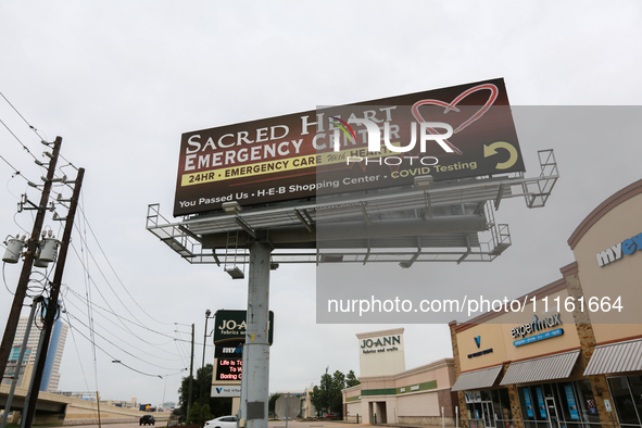 A billboard for the Sacred Heart Emergency Center is standing near their facility in Houston, Texas, on April 20, 2024. 