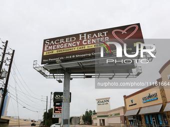 A billboard for the Sacred Heart Emergency Center is standing near their facility in Houston, Texas, on April 20, 2024. (