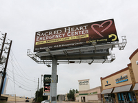 A billboard for the Sacred Heart Emergency Center is standing near their facility in Houston, Texas, on April 20, 2024. (