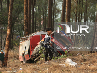 Nepali officials are fixing chains to extract the remains of a firefighting engine that crashed while it was being deployed to douse a fores...