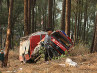 Nepali officials are fixing chains to extract the remains of a firefighting engine that crashed while it was being deployed to douse a fores...