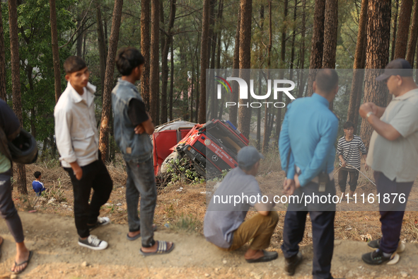 A firefighting engine is crashing in the woods while rushing to douse a forest fire on the outskirts of Kathmandu, Nepal, on April 20, 2024....