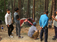 A firefighting engine is crashing in the woods while rushing to douse a forest fire on the outskirts of Kathmandu, Nepal, on April 20, 2024....