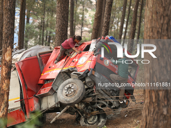 Nepali officials are scouring through the remains of a crashed firefighting engine that crashed while being deployed to douse a forest fire...