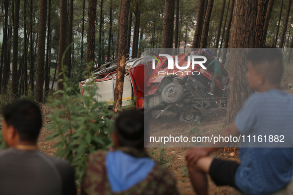 A firefighting engine is crashing in the woods while rushing to douse a forest fire on the outskirts of Kathmandu, Nepal, on April 20, 2024....