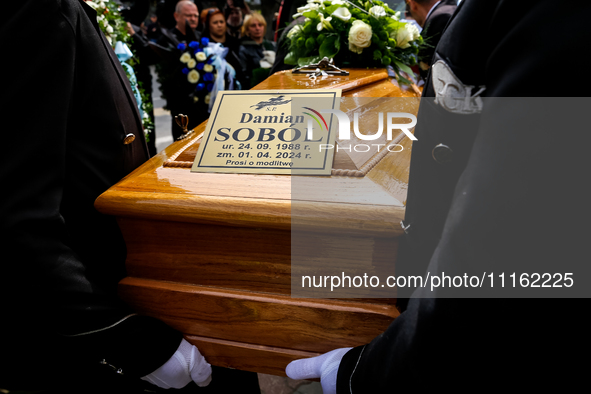 A coffin is seen during a funeral of Damian Sobol, a volunteer for World Central Kitchen, who was killed in an Israeli attack on Gaza Strip,...