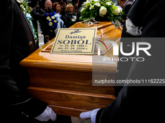 A coffin is seen during a funeral of Damian Sobol, a volunteer for World Central Kitchen, who was killed in an Israeli attack on Gaza Strip,...