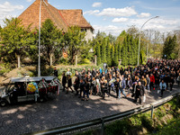 Family and friends walk in a funeral procession as they attend a funeral of Damian Sobol, a volunteer for World Central Kitchen, who was kil...